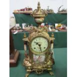 Franz Herule ormolu mantle clock with porcelain panels, with key, in going order. Damage to back