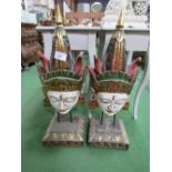 A pair of colourful Balinese face masks on stands, 32" tall