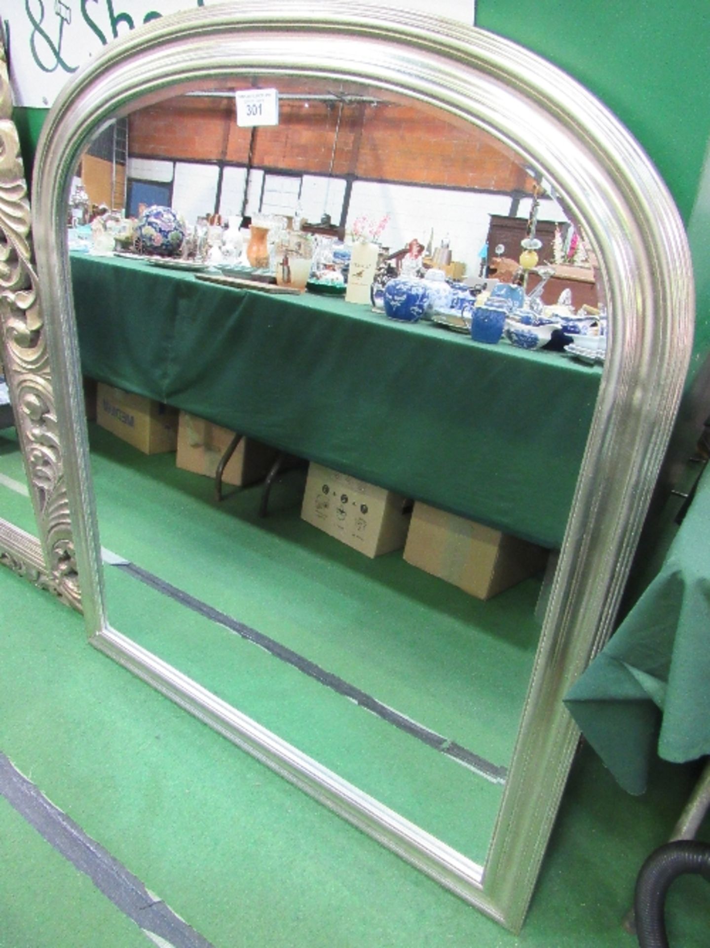 Arched top silver framed bevel-edged wall mirror, 48" x 42"