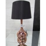 Copper-coloured table lamp with black shade