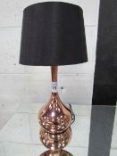 Copper-coloured table lamp with black shade