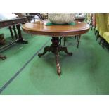 Mahogany circular tilt-top table on ornate pedestal to 3 legs on casters, 40" diameter x 28" high