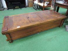 Antique Indonesian rice bed with central hatch door for access to internal storage, 72" x 31" x 17"