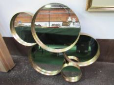 Montage of 5 circular mirrors