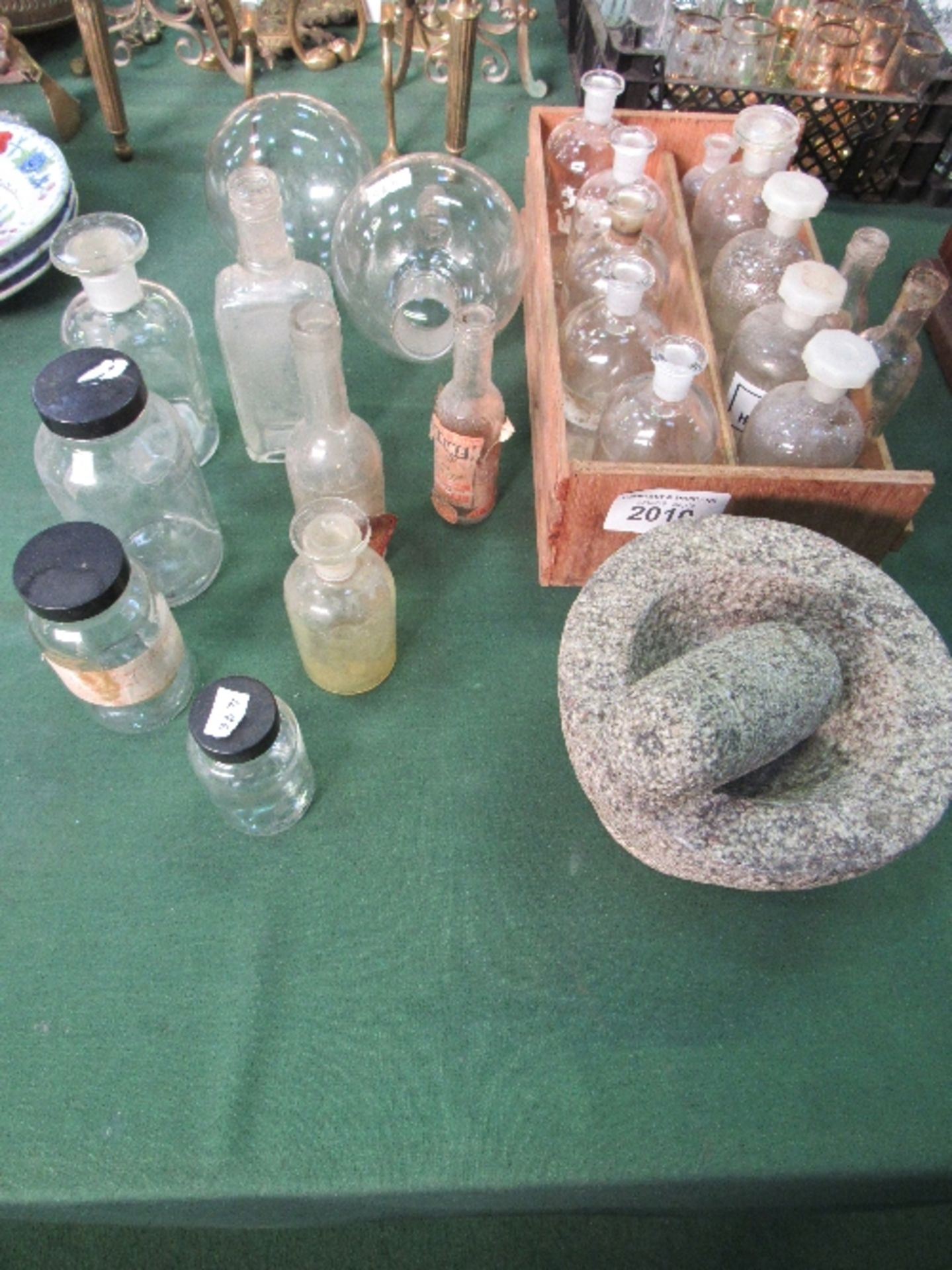 A qty of glass medical jars & a stone pestle & mortar