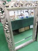 Ornately framed bevel-edged wall mirror, 49' x 36'