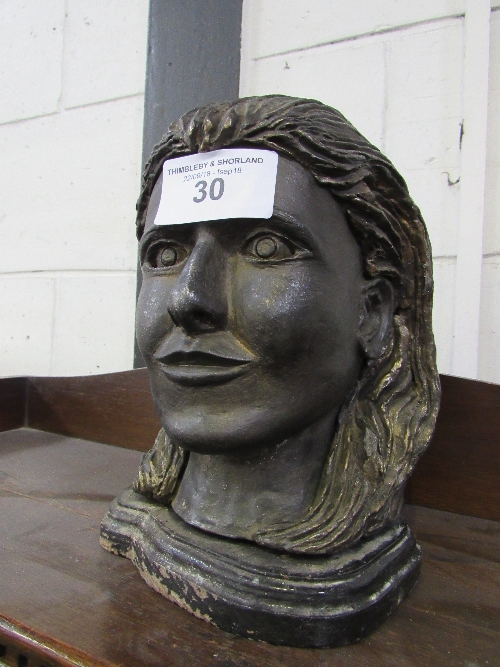 Cast metal female head on wooden base