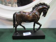 Model bronzed horse on wooden plinth