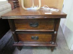 A pair of Indonesian hardwood bedside chests of 2 drawers