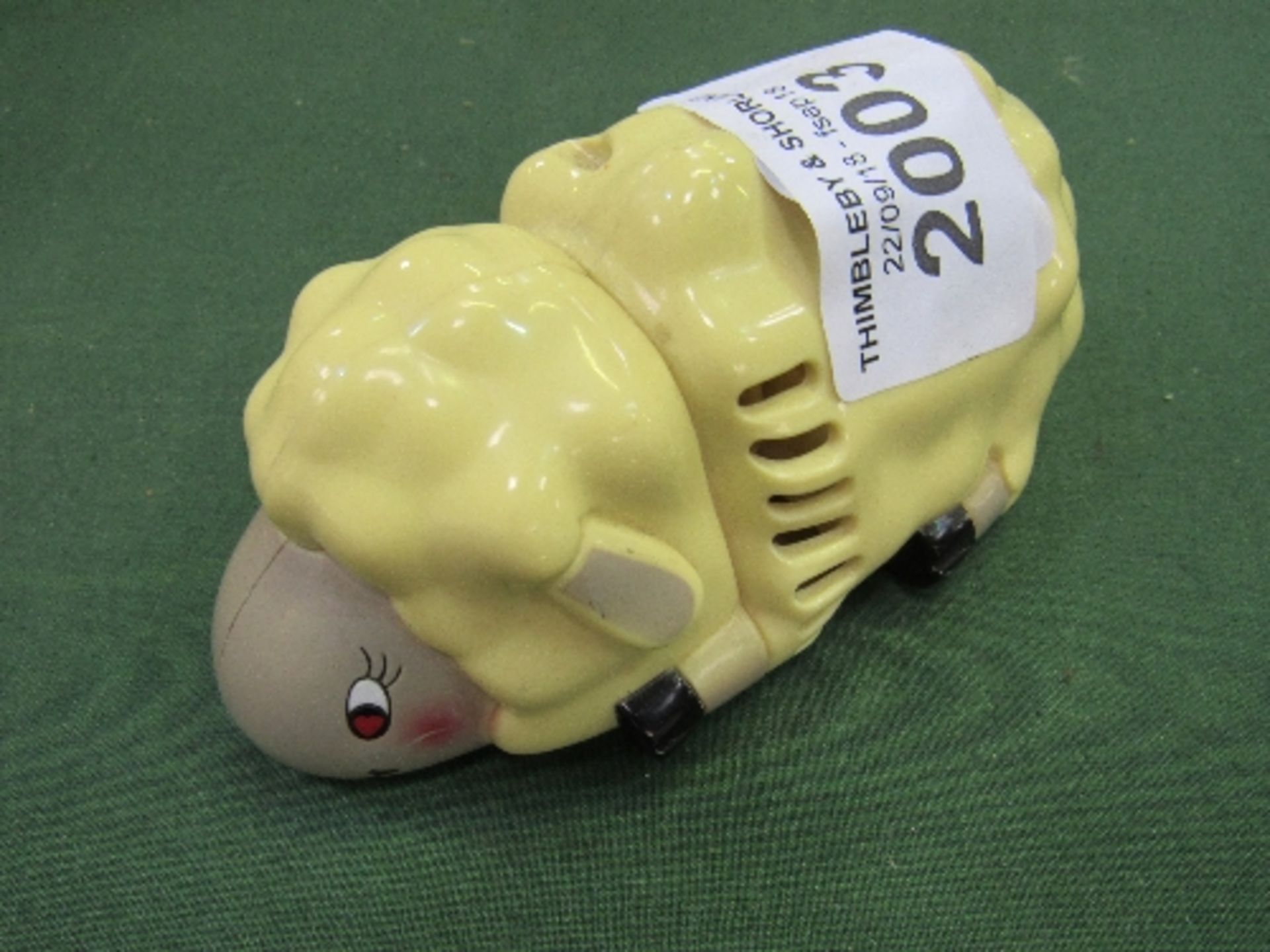 Retro plastic battery-powered table vacuum in the form of a sheep