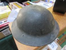 A Brodie 1930's Mark I* British Army helmet c/w original chin strap & liner in fair condition