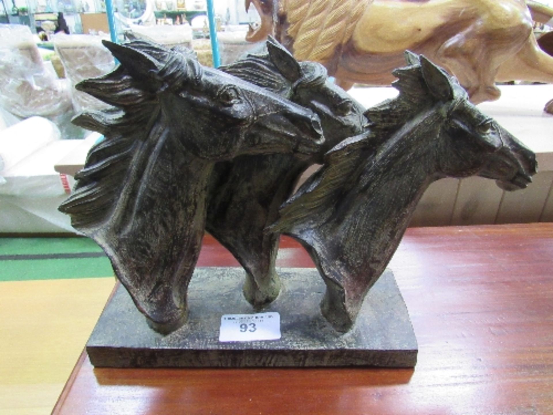 Ornament of a trio of horses' heads