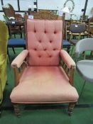 Edwardian mahogany framed button-back armchair on casters