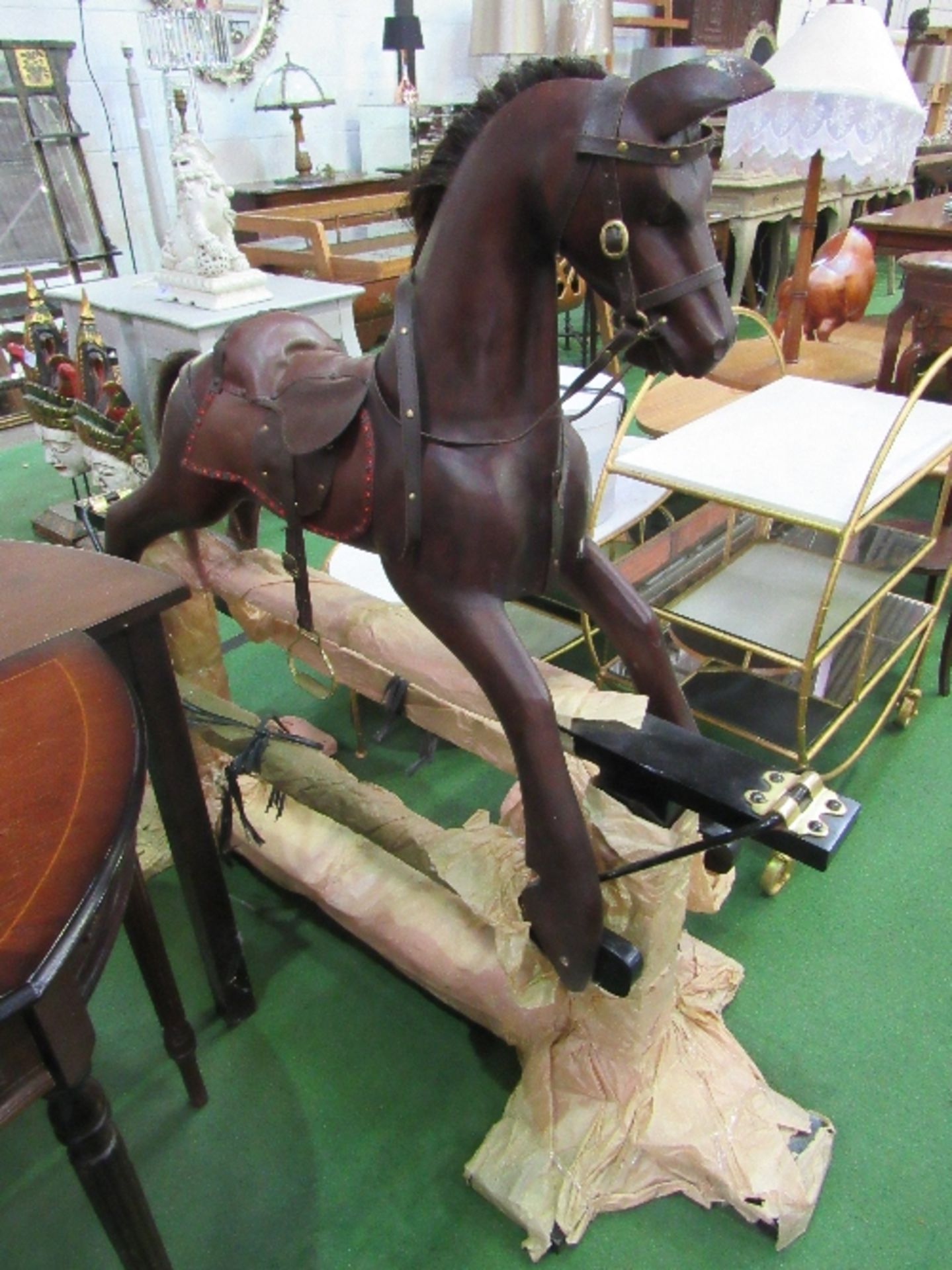 Dark wood rocking horse on stand