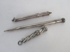 3 hallmarked sterling silver propelling pencils. Price guide £20-25.