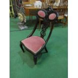 Victorian Ebonised nursing chair with pierced splat back & carved top rail. Price guide £30-50.