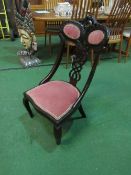 Victorian Ebonised nursing chair with pierced splat back & carved top rail. Price guide £30-50.