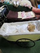 2 porcelain dolls in a vintage small pram & another porcelain doll in a small Silver Cross pram.