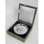 Sterling silver Armada dish with a Hong Kong dollar inset, boxed, wt 2.16 troy oz. Price guide £30-