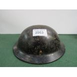 1940's British Civilian-issue Bakerlite Brodie helmet, marked Plasfort. Price guide £30-40.