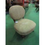 Victorian padded nursing chair with deep sprung seat & turned front legs. Price guide £20-30.