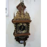 Dutch Zaandam ornamental pendulum wall clock with twin weights. Price guide £50-80.