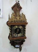 Dutch Zaandam ornamental pendulum wall clock with twin weights. Price guide £50-80.