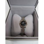 Lady's Gucci watch with metal bracelet strap, in box, going. Price guide £50-80.