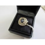 18 carat gold sapphire & diamond cluster ring, set with approx 1.5 carats of 8 cut diamonds. Price