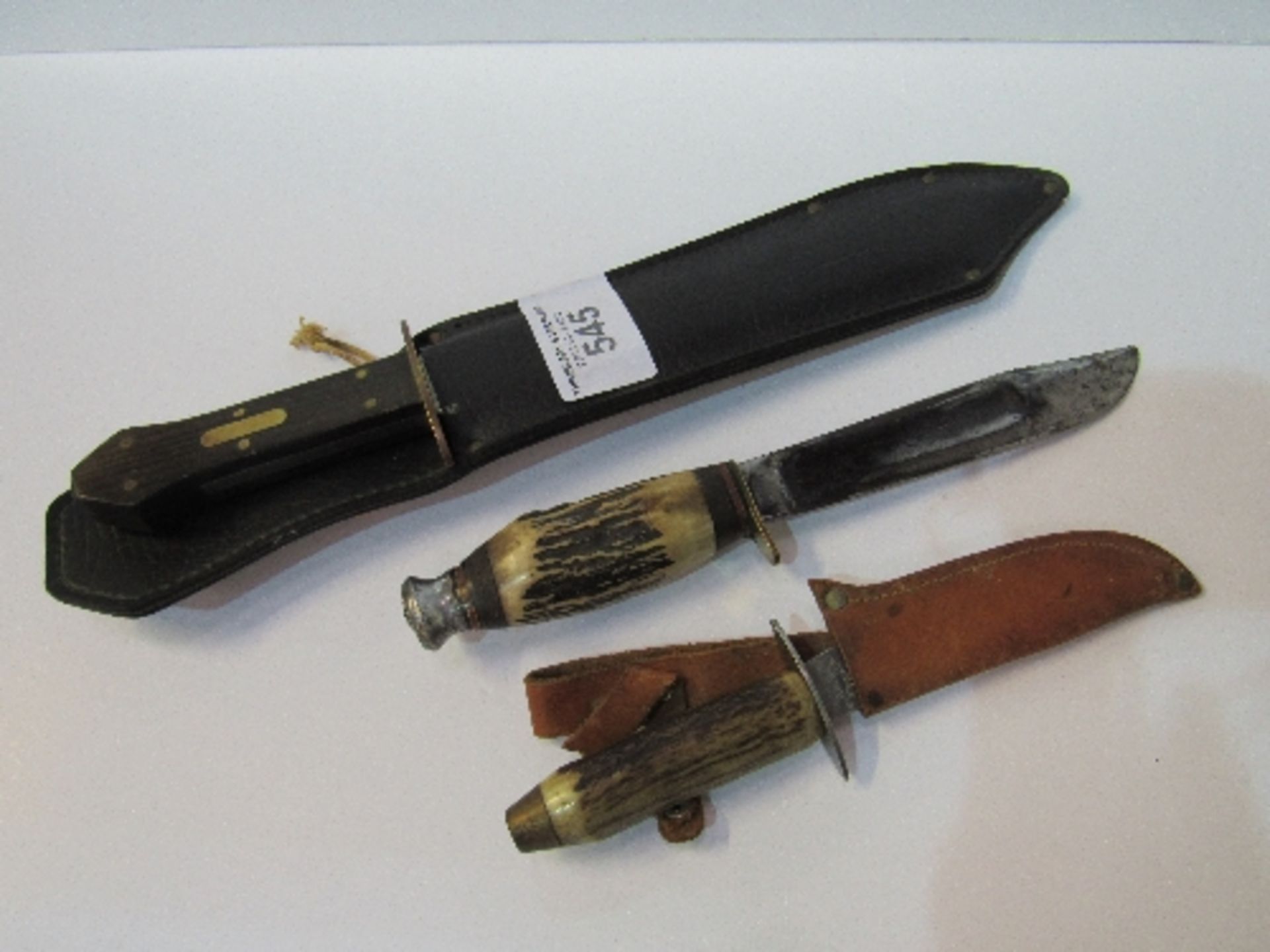 Coffin handled 10.5"" Bowie knife in leather scabbard & 2 bone handled sheath knives. Price guide £