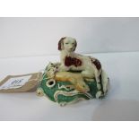 Early 19th century Staffordshire dog with hare pen holder. Price guide £40-60.