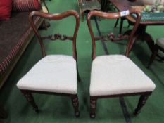 4 Victorian mahogany upholstered seats with carved scrolled splat backs. Price guide £60-80.