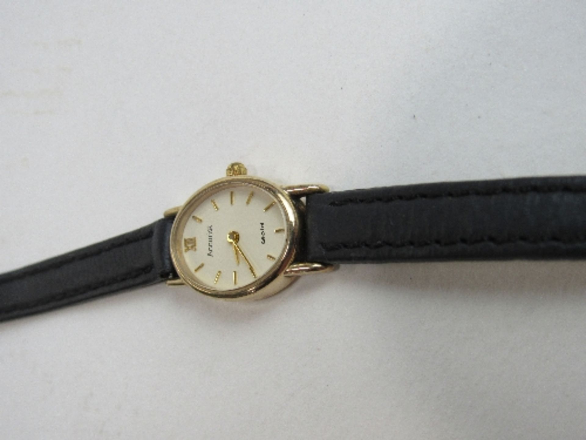 Accurist lady's wristwatch, 9ct gold case with black leather strap. Price guide £60-70. - Image 2 of 2