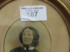 Pair of oval framed & glazed enhanced photographs of Victorian ladies. Price guide £30-40.