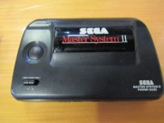 SEGA Mastersystem III console c/w games & controllers. Price guide £30-40.