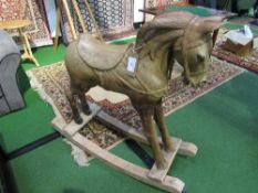 Pine carved horse on rockers (a/f). Price guide £50-60.