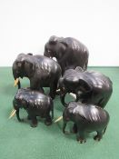 A 'family' of 5 ebony elephants. Price guide £30-40.