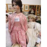 2 porcelain dolls in long dresses. Price guide £20-40.