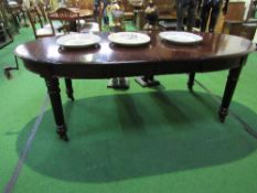 Mahogany D-end wind-out dining table on turned reeded legs & casters c/w 2 leaves & handle, 212cms x