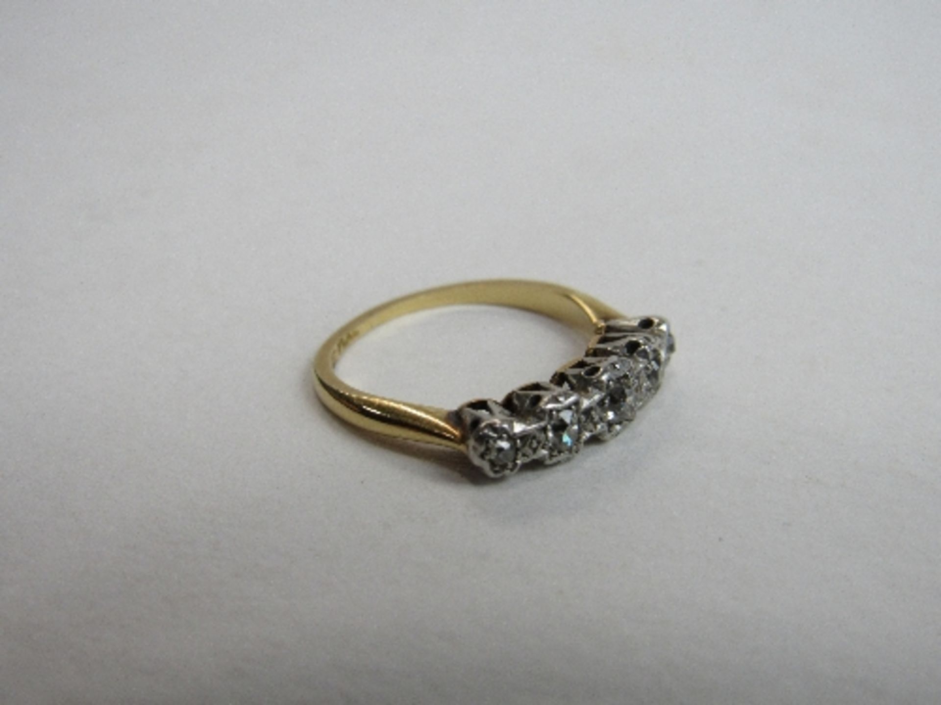 18ct gold & platinum ring set with 5 diamonds, size M, wt 3.2gms. Price guide £100-150.