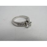 14ct white gold (tested as 14ct) diamond ring with a main stone, 3/4ct with diamonds on shoulder,