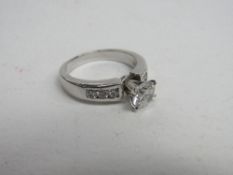 14ct white gold (tested as 14ct) diamond ring with a main stone, 3/4ct with diamonds on shoulder,