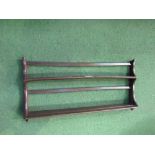 Ercol wall plate rack. Price guide £10-15.