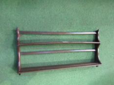 Ercol wall plate rack. Price guide £10-15.