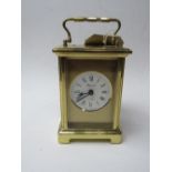 Bayard 8-day carriage clock, a wooden cased small mantle clock, silver metal cased clock & green