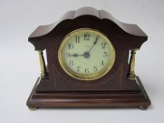 8 day wood inlaid desk/mantle clock. Price guide £25-30.