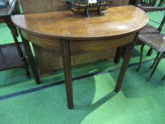 Mahogany demi-lune table on 4 block legs, 114cms x 56cms x 74cms. Price guide 5-10.