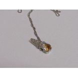 18ct white gold & yellow sapphire pendant on 18ct white gold chain, weight 6.7gms. Price guide £