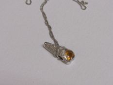 18ct white gold & yellow sapphire pendant on 18ct white gold chain, weight 6.7gms. Price guide £