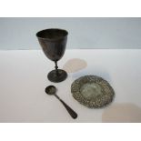 A silver small goblet, a silver condiment spoon, total weight 2.40ozt. A heavily decorated small